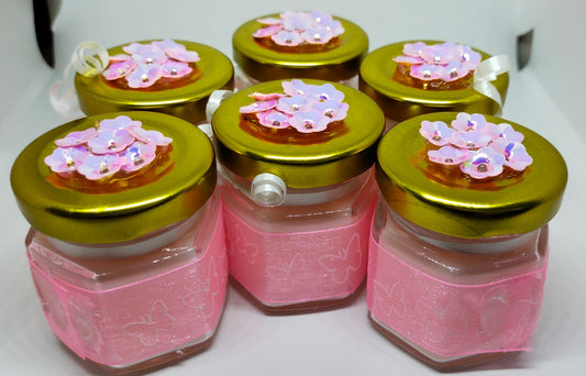 Envase de vidrio hexagonal con tapa metálica