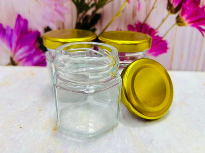 Envase de vidrio hexagonal con tapa metálica
